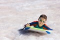 Boy swimming on boogie board Royalty Free Stock Photo