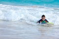 Boy swimming on boogie board Royalty Free Stock Photo