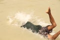 Boy is swimming in the Ganga  river in India. Royalty Free Stock Photo