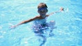 Boy swimming goggles in the pool looking at the camera Royalty Free Stock Photo