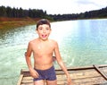 boy swimming in the lake on their summer country holiday Royalty Free Stock Photo