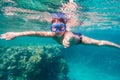 Boy in swimming mask dive in Red sea near coral reef Royalty Free Stock Photo
