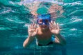 Boy in swimming mask dive in Red sea near pontoon Royalty Free Stock Photo