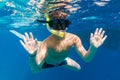 Boy in swimming mask dive in Red sea near yacht Royalty Free Stock Photo