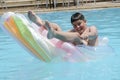 Boy in swimming in the pool Royalty Free Stock Photo