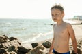 Boy in swimming trunks resting on sea Royalty Free Stock Photo