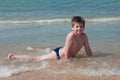 A boy swims in the sea Royalty Free Stock Photo