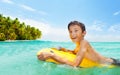 Boy swim on body board in the sea and smile Royalty Free Stock Photo