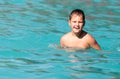 Boy swims in the water park Royalty Free Stock Photo