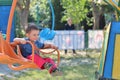 Boy in swing ride Royalty Free Stock Photo