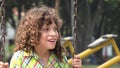 Boy Swinging on Swing Set