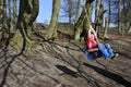 Boy swinging in the trees