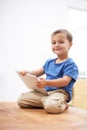 Boy, tablet and portrait with games, kid and internet with network, connection and home. Child development, apartment