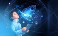 Boy with tablet, startup rocket hologram and business icons