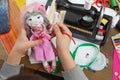 Boy tailor learns to sew, dress for doll, handmade and handicraft concept