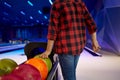 Boy takes a ball at the lane in bowling alley Royalty Free Stock Photo