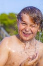Boy takes a shower at the beach Royalty Free Stock Photo