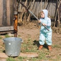 Boy takes water from a well in village (1)