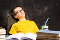 Boy taking a nap while finishing homework Royalty Free Stock Photo