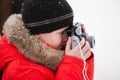 Boy taking photos on winter day Royalty Free Stock Photo