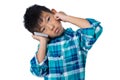 Boy talking on mobile phone against white background Royalty Free Stock Photo
