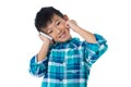 Boy talking on mobile phone against white background Royalty Free Stock Photo