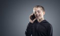 Boy talking on mobile phone, happy and smiling background Royalty Free Stock Photo