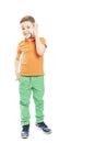 The boy is talking on a smartphone, full-length. Free space for text. Vertical. Isolated on a white background