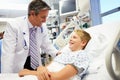 Boy Talking To Male Doctor In Emergency Room Royalty Free Stock Photo