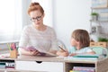 Boy and teacher in classroom Royalty Free Stock Photo