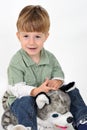 Boy with a teddy dog Royalty Free Stock Photo