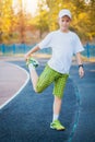 Boy Teen doing sports exercises on a stadium Royalty Free Stock Photo