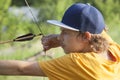 Boy teenager archer aiming arrow Royalty Free Stock Photo