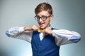 Boy teenager with braces in glasses. Wearing a shirt with a bow tie. Royalty Free Stock Photo