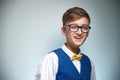 Boy teenager with braces in glasses. Wearing a shirt with a bow tie. Royalty Free Stock Photo