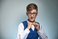 Boy teenager with braces in glasses. Wearing a shirt with a bow tie. Royalty Free Stock Photo