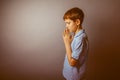 Boy teenager European appearance in a blue shirt