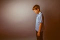 Boy teenager European appearance in a blue shirt