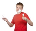 The boy, the teenager the first time tries to have a shave .Portrait on a white background