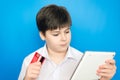 Boy teenager makes a purchase on Internet Royalty Free Stock Photo