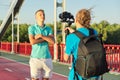 Boy teenager model and male photographer taking photos videos with camera and stabilizer Royalty Free Stock Photo
