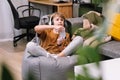 Boy teenager playing video game with joystick sitting on frameless beanbag chair Royalty Free Stock Photo