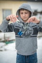 Boy the teenager plays with the yo-yo on the street Royalty Free Stock Photo