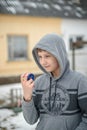 Boy the teenager plays with the yo-yo on the street Royalty Free Stock Photo