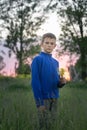 Boy teenager on a red sunset background. Royalty Free Stock Photo