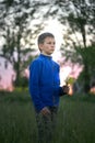 Boy teenager on a red sunset background. Royalty Free Stock Photo