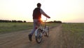 Boy teenager riding a bicycle. Boy teenager riding bicycle goes nature along the path steadicam shot motion video Royalty Free Stock Photo