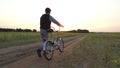 Boy teenager riding a bicycle. Boy teenager riding bicycle goes nature along the path steadicam shot motion video Royalty Free Stock Photo