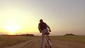 Boy teenager riding a bicycle. Boy teenager riding a bicycle goes to nature along the path steadicam shot video motion Royalty Free Stock Photo