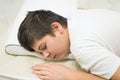 Boy teenager sleeping face down on anatomic pillow Royalty Free Stock Photo